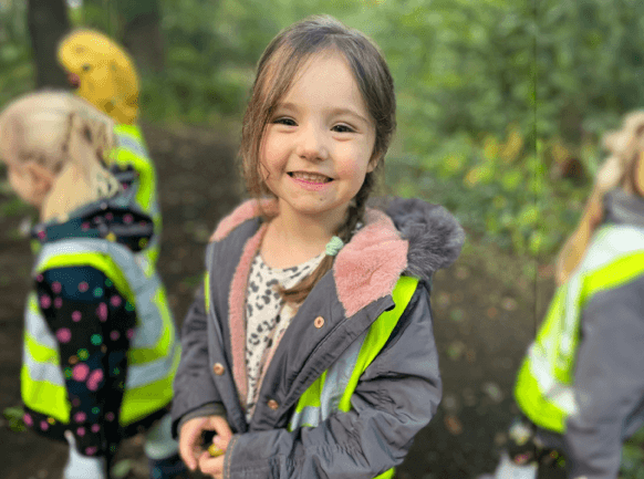 creativity and imagination child in the forest in hi viz